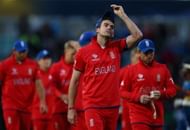 James Anderson of England and his team-mates look dejected as they walk off after losing the ICC Champions Trophy Group A match between England and Sri Lanka at The Kia Oval on June 13, 2013 in London, England. (Photo by Paul Gilham/Getty Images)